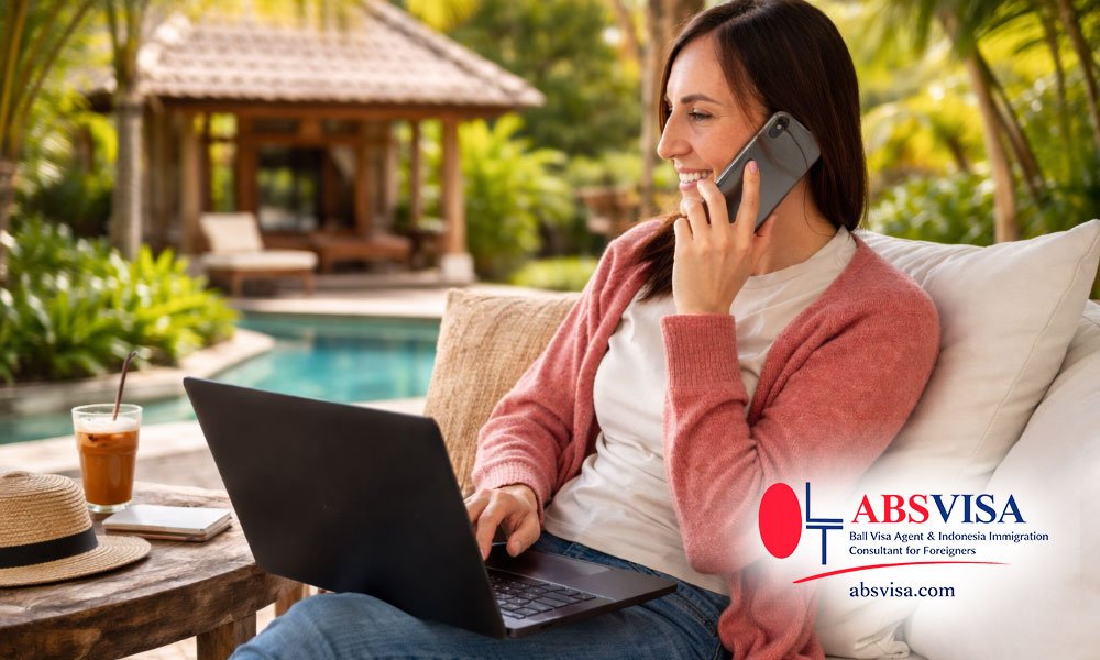 Remote worker woman working from a luxury villa in Bali Indonesia using laptop and phone digital nomad lifestyle