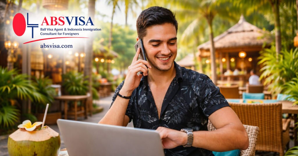 Remote worker working from a tropical cafe in Bali Indonesia with laptop and phone enjoying digital nomad lifestyle